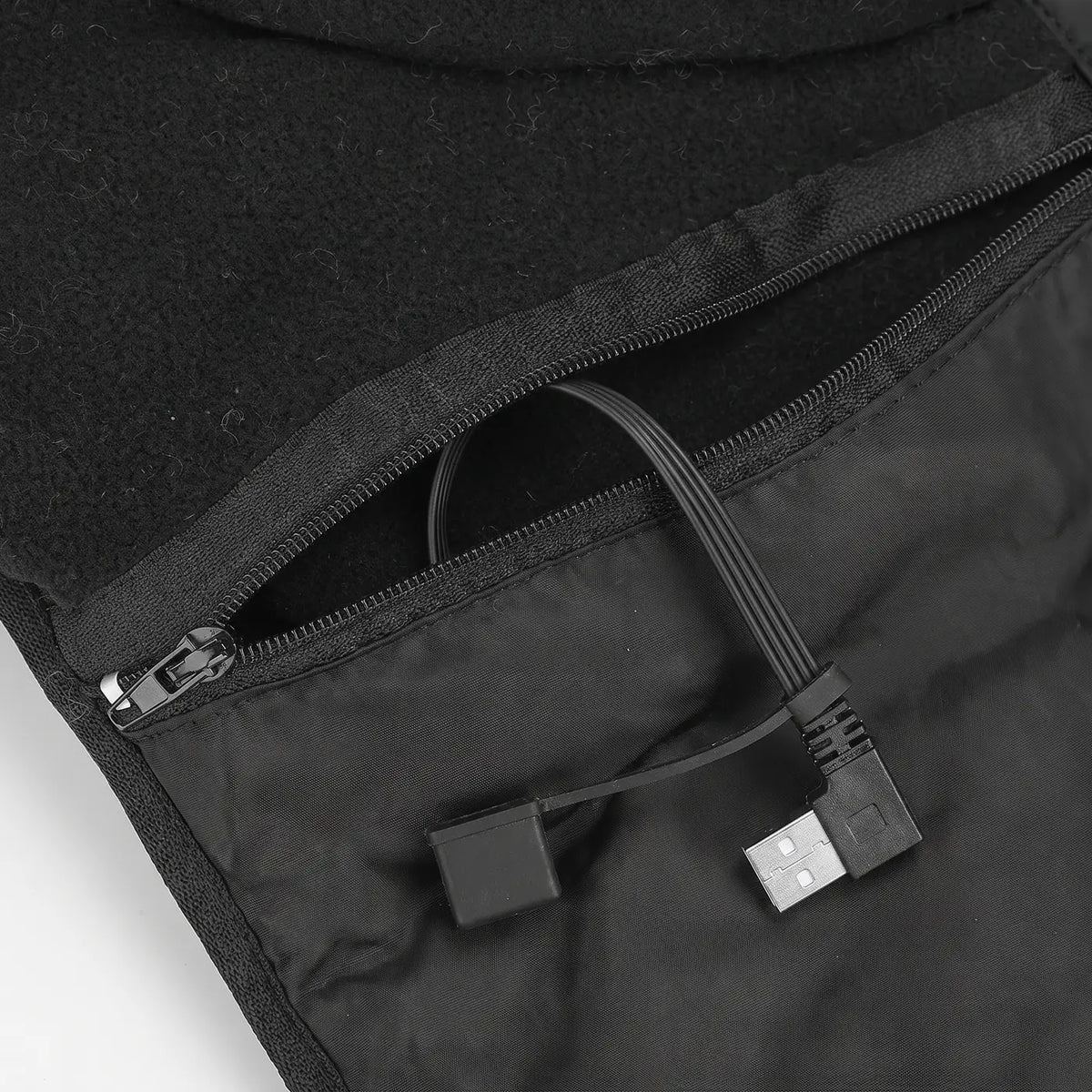 Zipped inside pocket with built-in USB cable