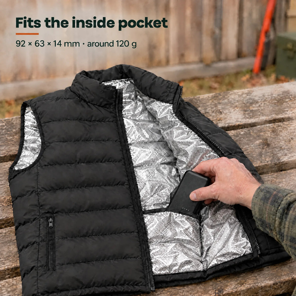 Power bank slid into the inside pocket of the Ridge vest – 92 × 63 × 14 mm, around 120 g