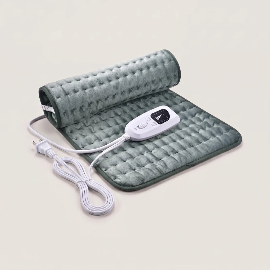 BergHeat Hearth heating pad in sage green, half rolled, with hand controller and US plug